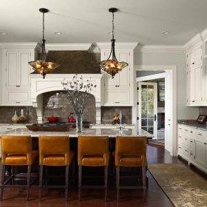 white granite kitchen worktops with mustard yellow chairs at breakfast bar