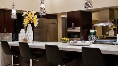 White Kitchen Worktop with Black Bar Stool