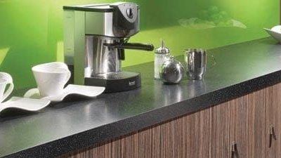 Black kitchen worktop with green kitchen decor